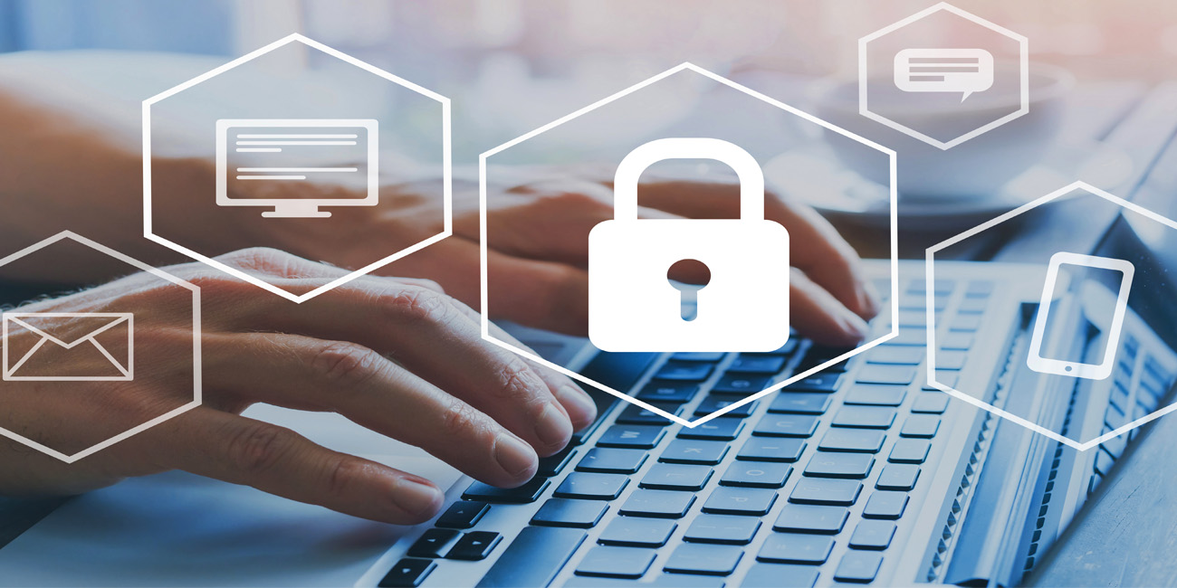 A person’s hands typing on a laptop keyboard with security images (a lock, email icon, mobile phone icon) overlaid on the screen